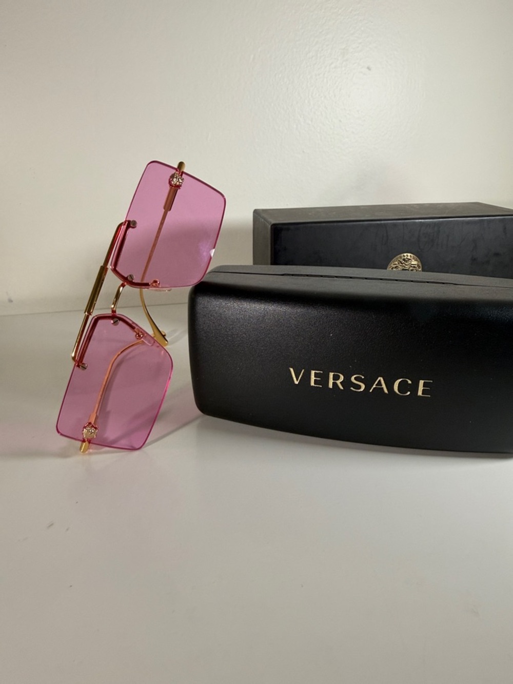 Versace Gold-Tone Temples Pink Rimless Sunglasses with Medusa accents